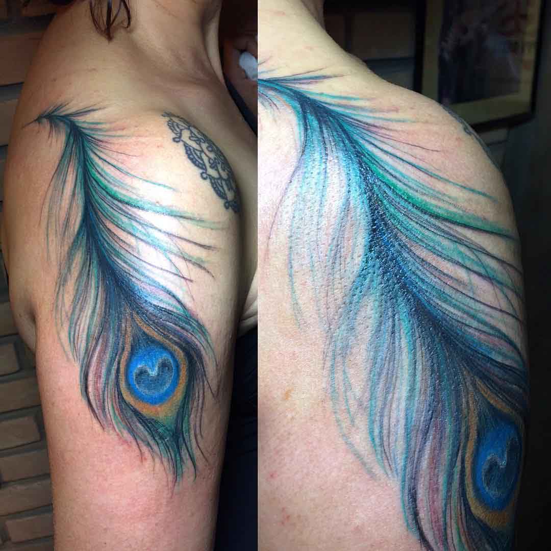 upper shoulder tattoo peacock feather