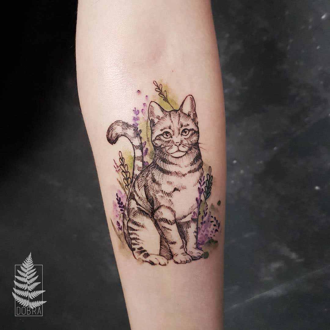 cat tattoo in flowers