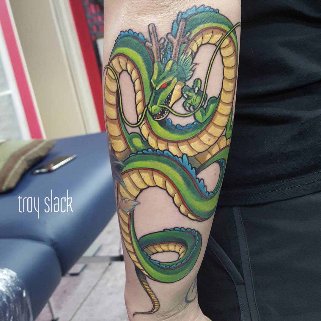 arm tattoo green dragon