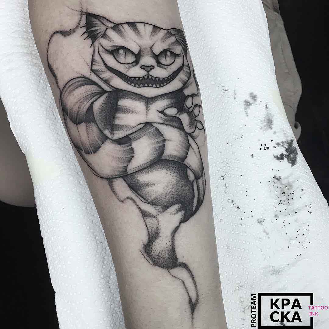 cat tattoo on arm