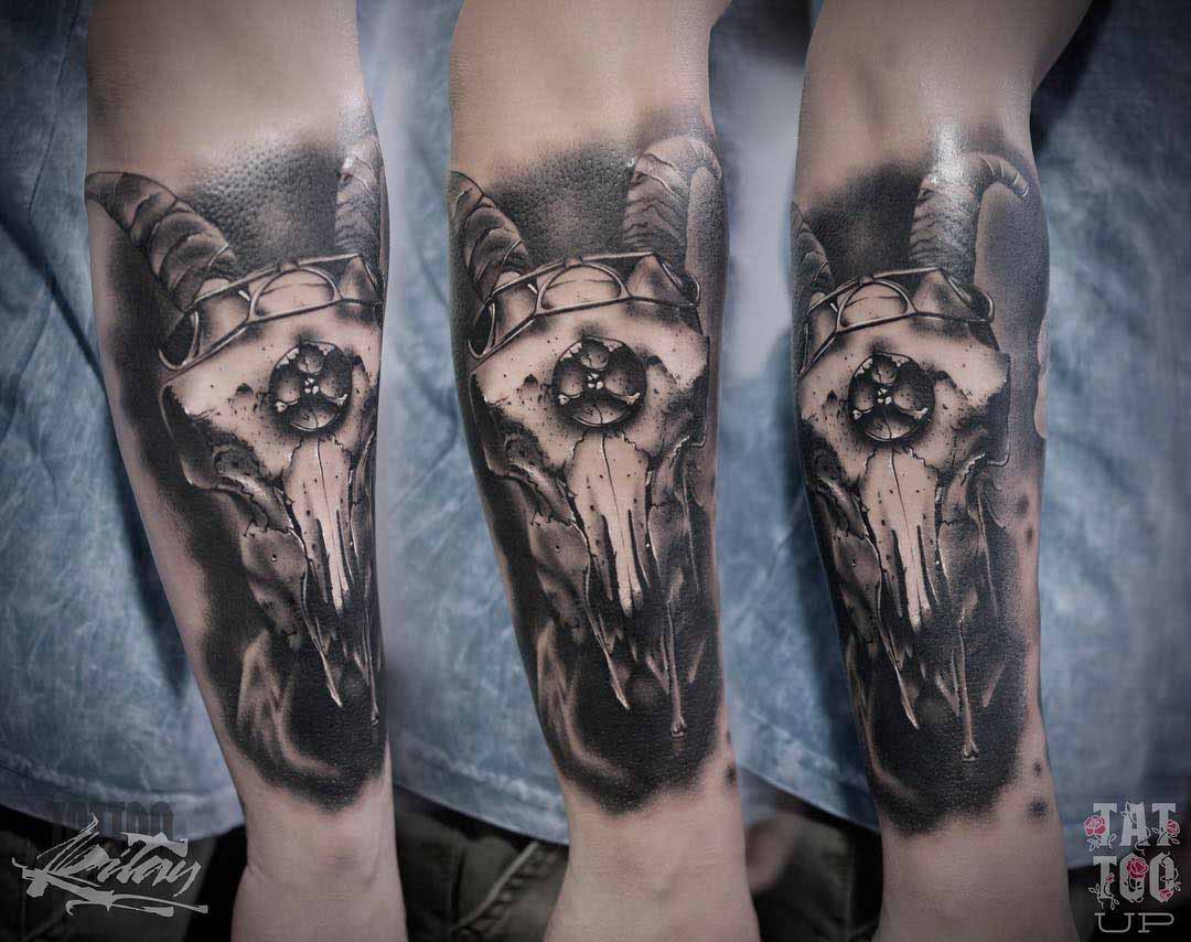 arm tattoo ram skull black and grey
