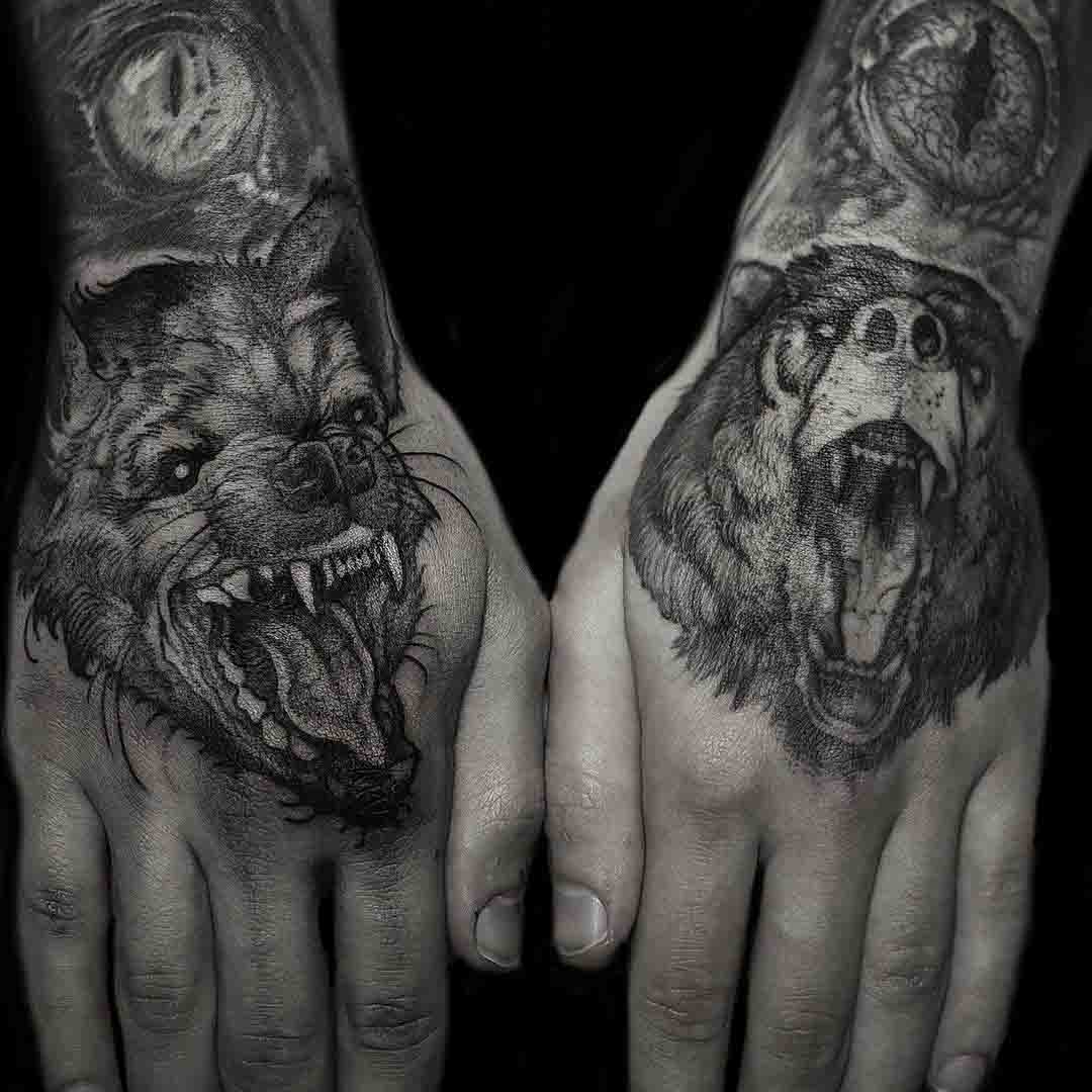 hyena tattoo and bear tattoo on hands