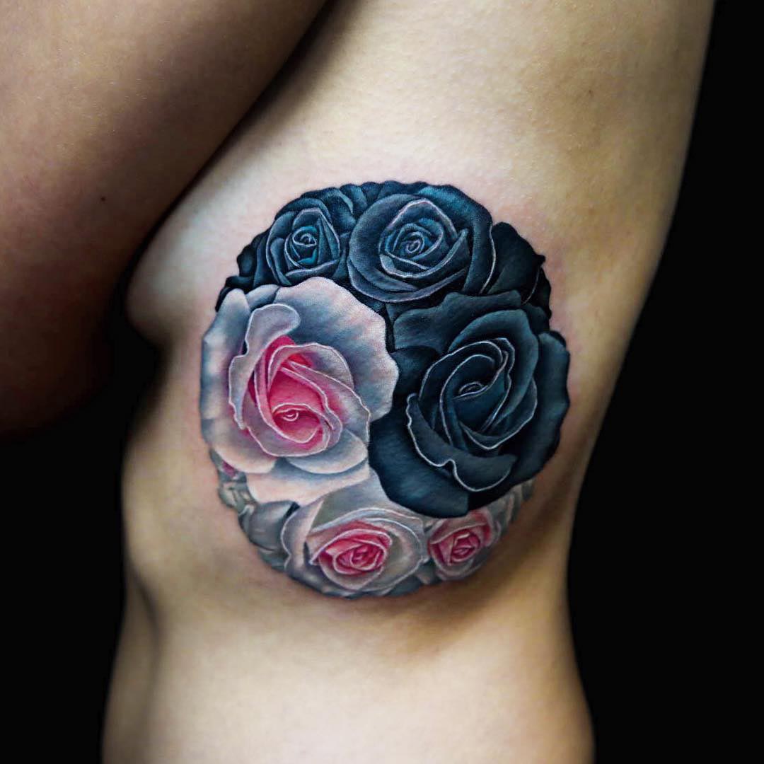 rib tattoo Yin Yang roses
