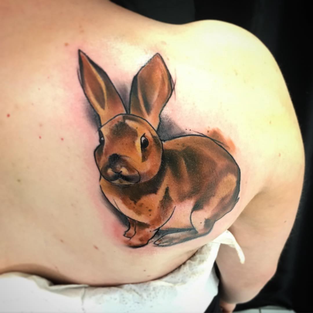 bunny tattoo on shoulder blade