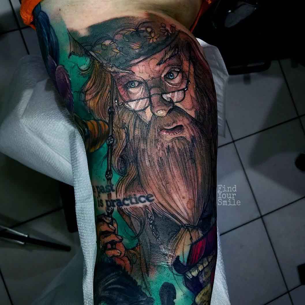 tattoo of a dumbledore on bicep