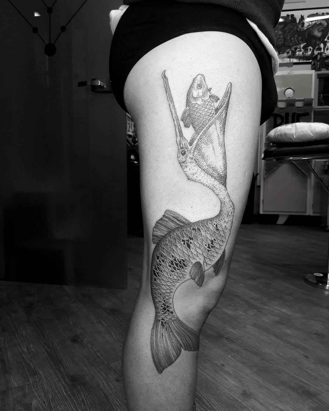thigh tattoo hunter bird fish
