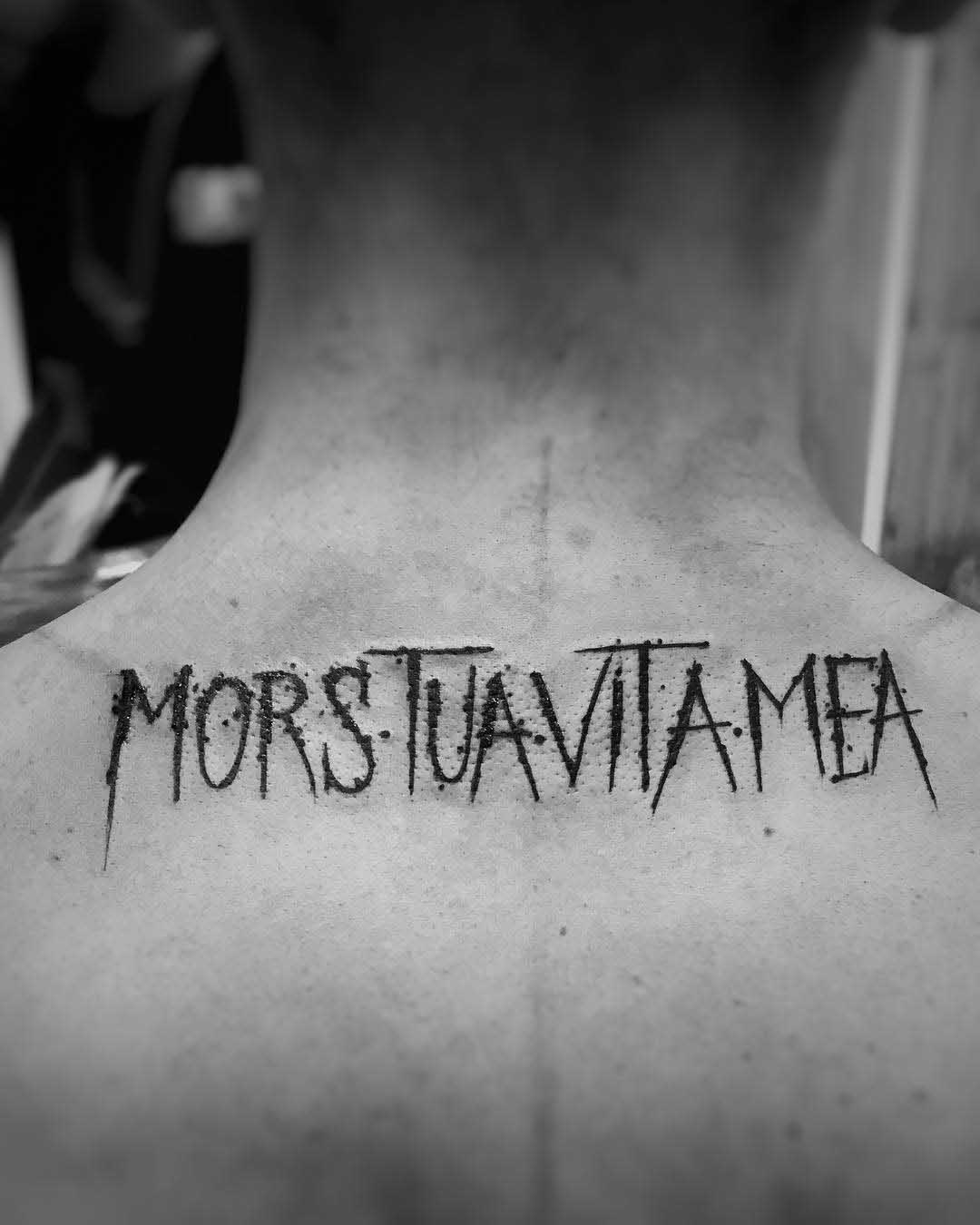 upper back tattoo lettering