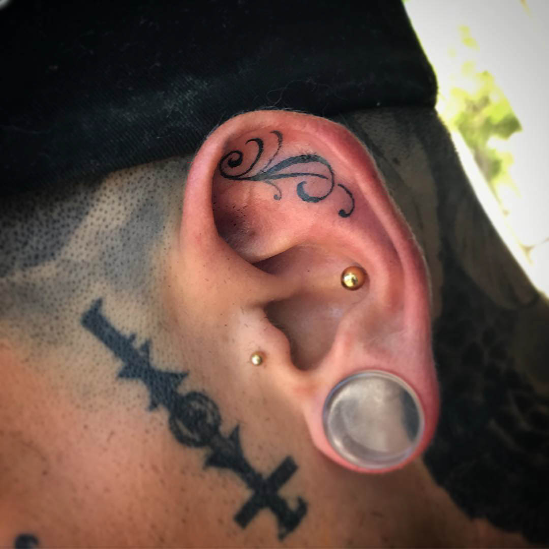 florish ear tattoo