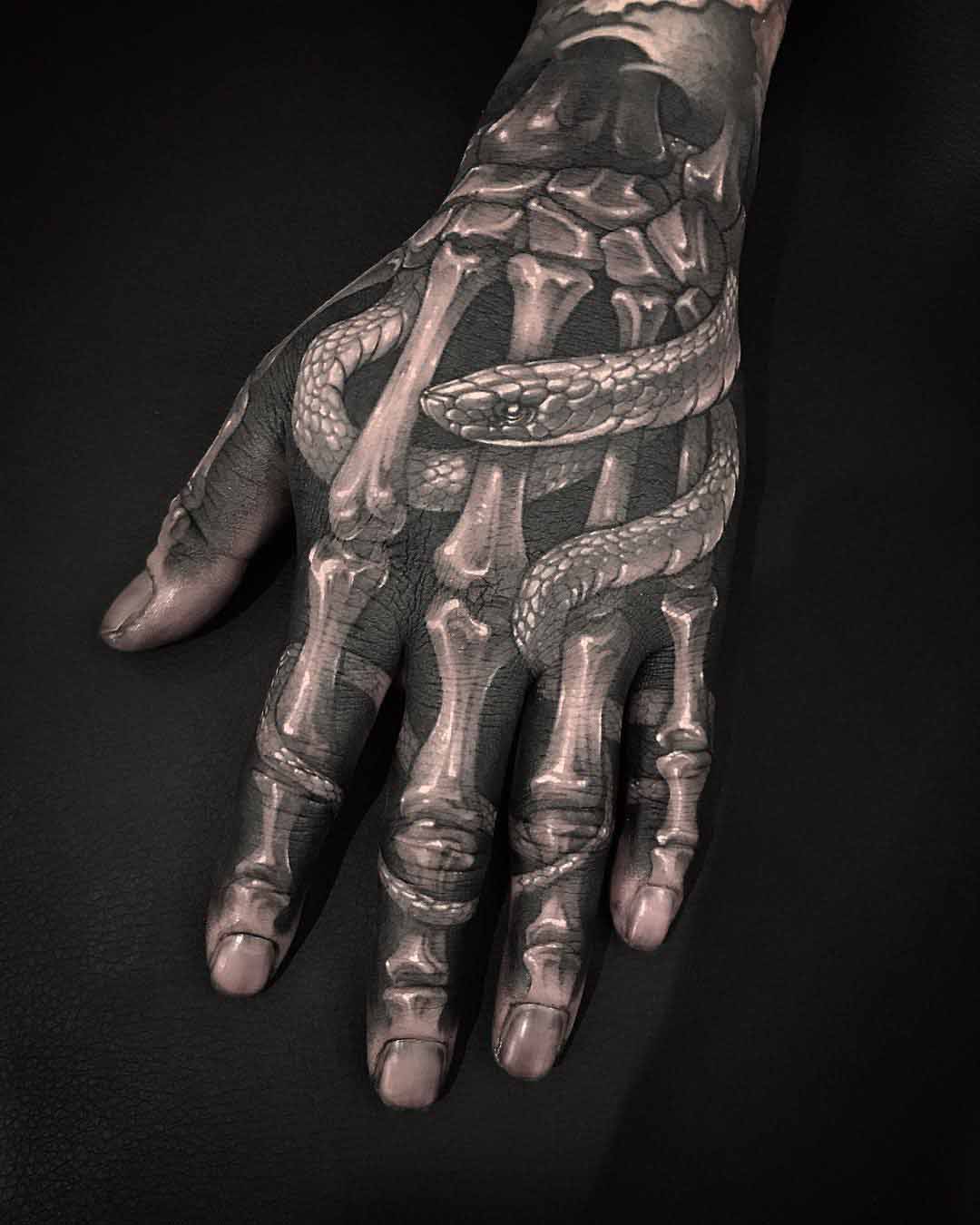 skeleton hand tattoo with snake