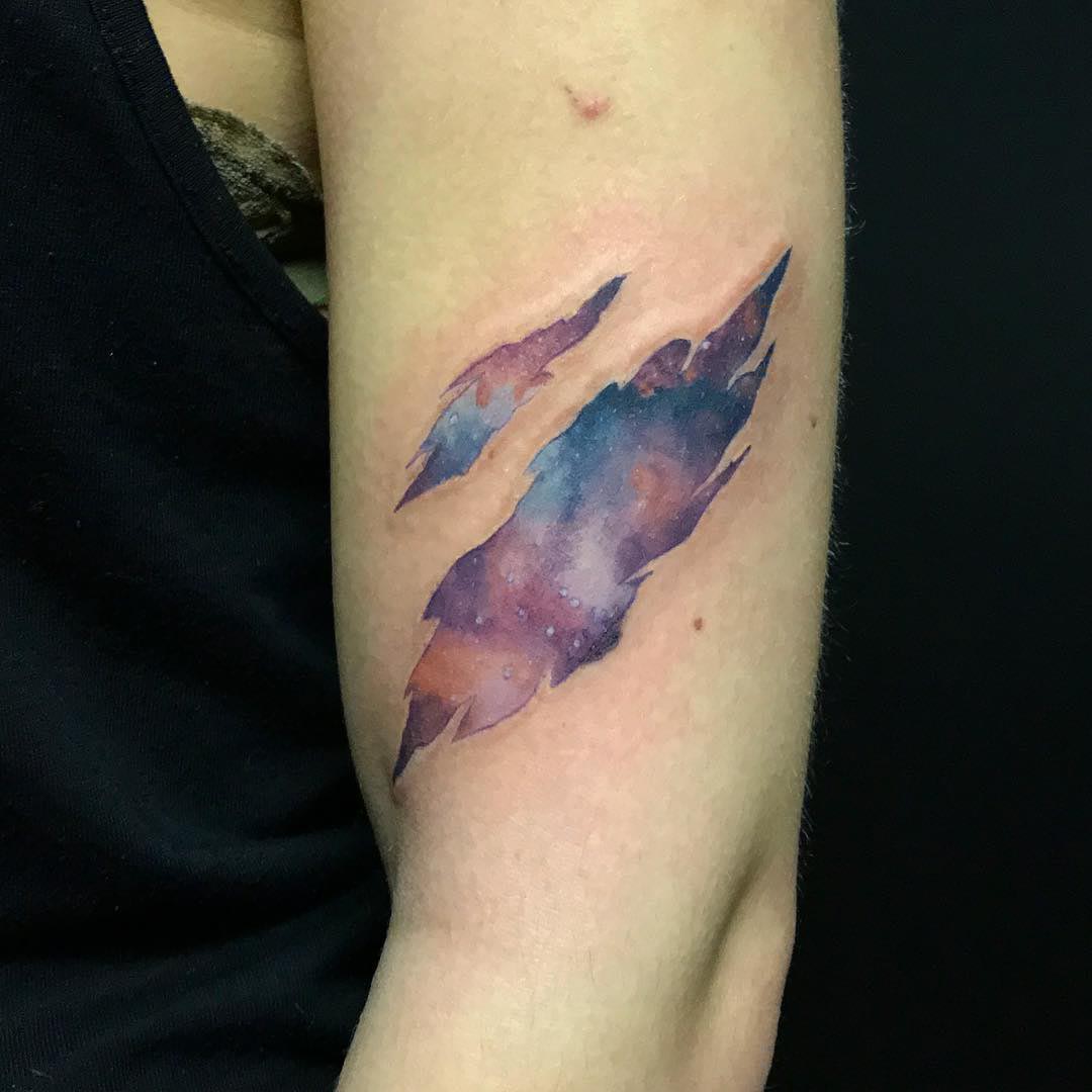 scratch tattoo galaxy on skin