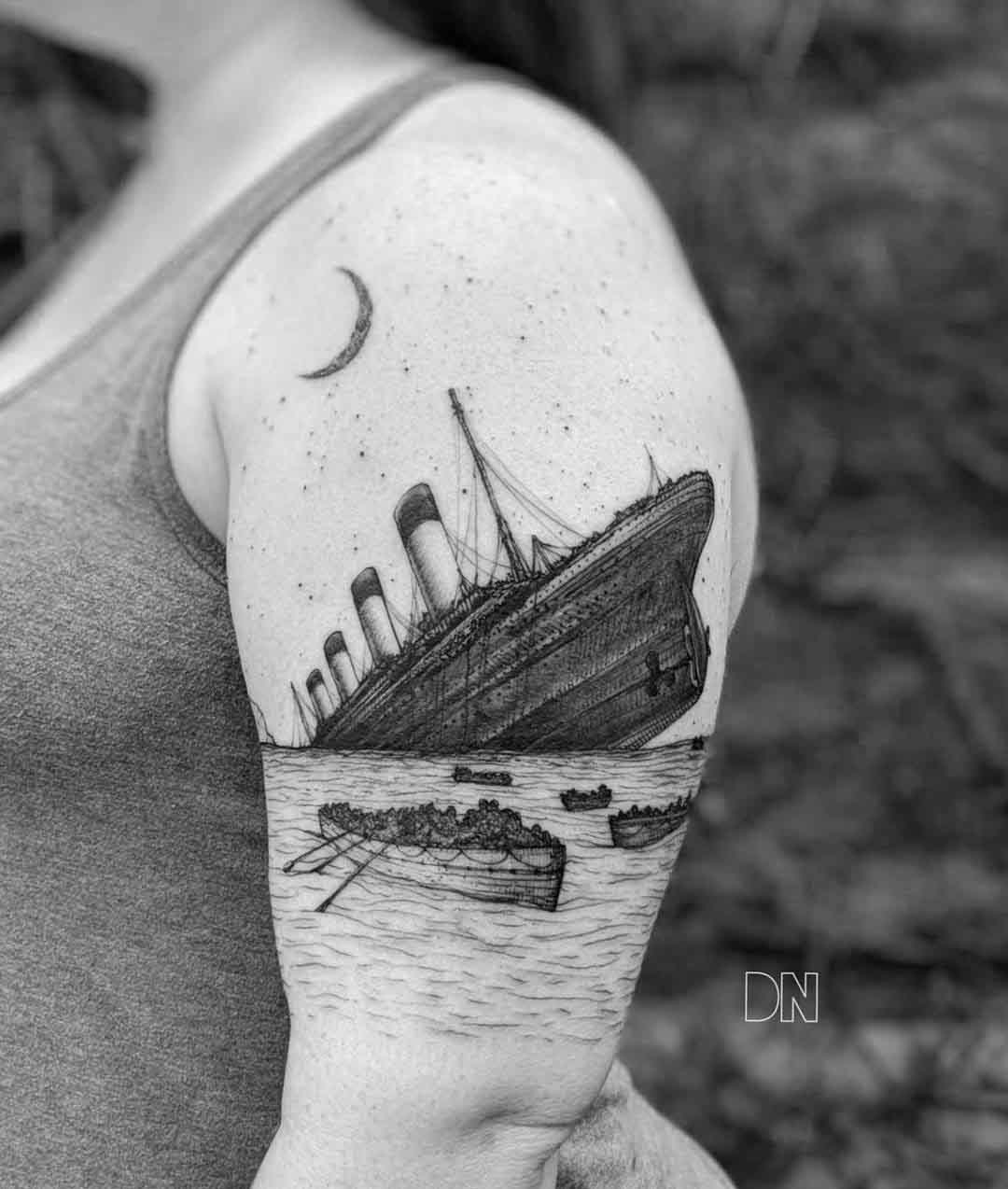 drawning titanic tattoo on shoulder