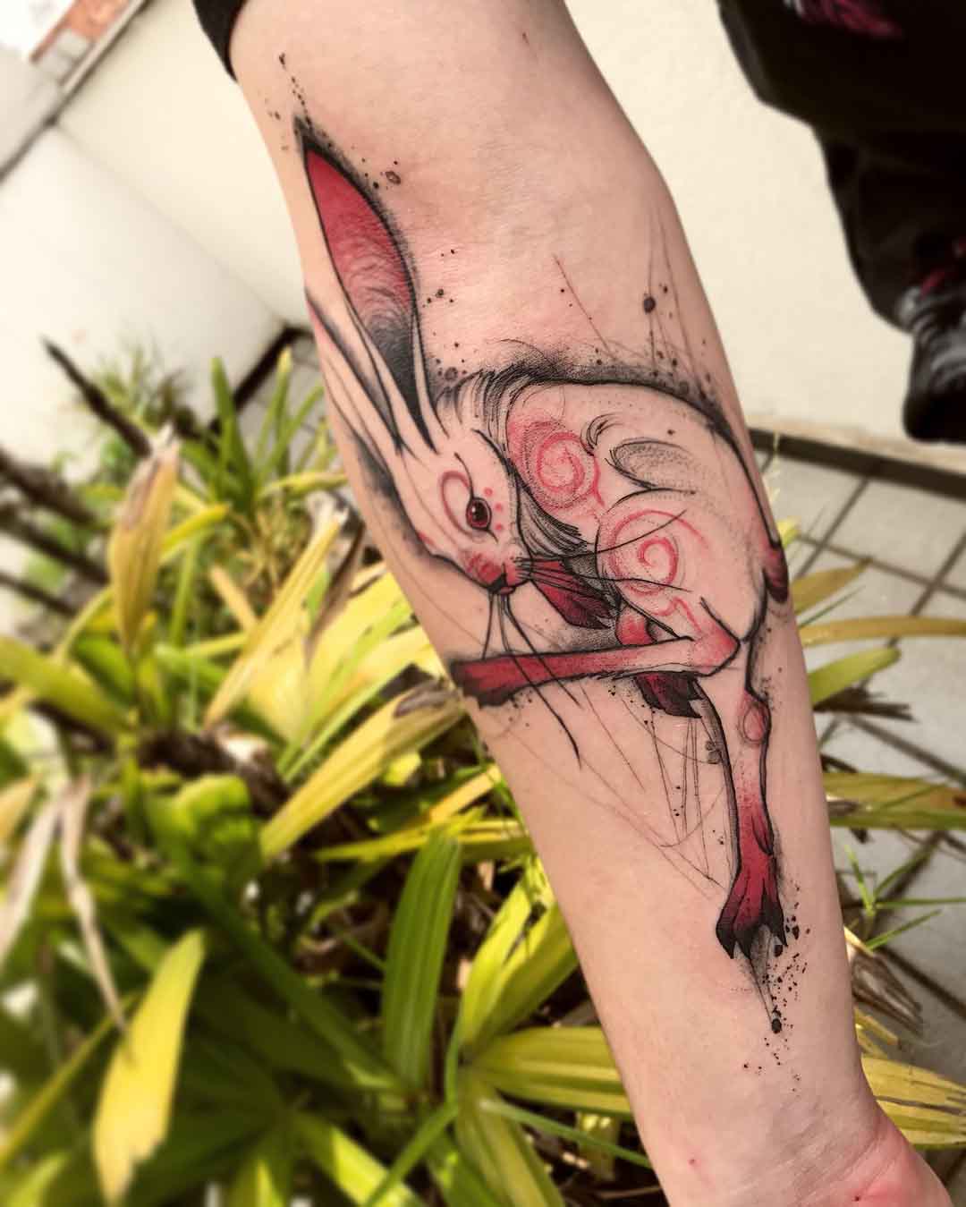 white rabbit tattoo on arm