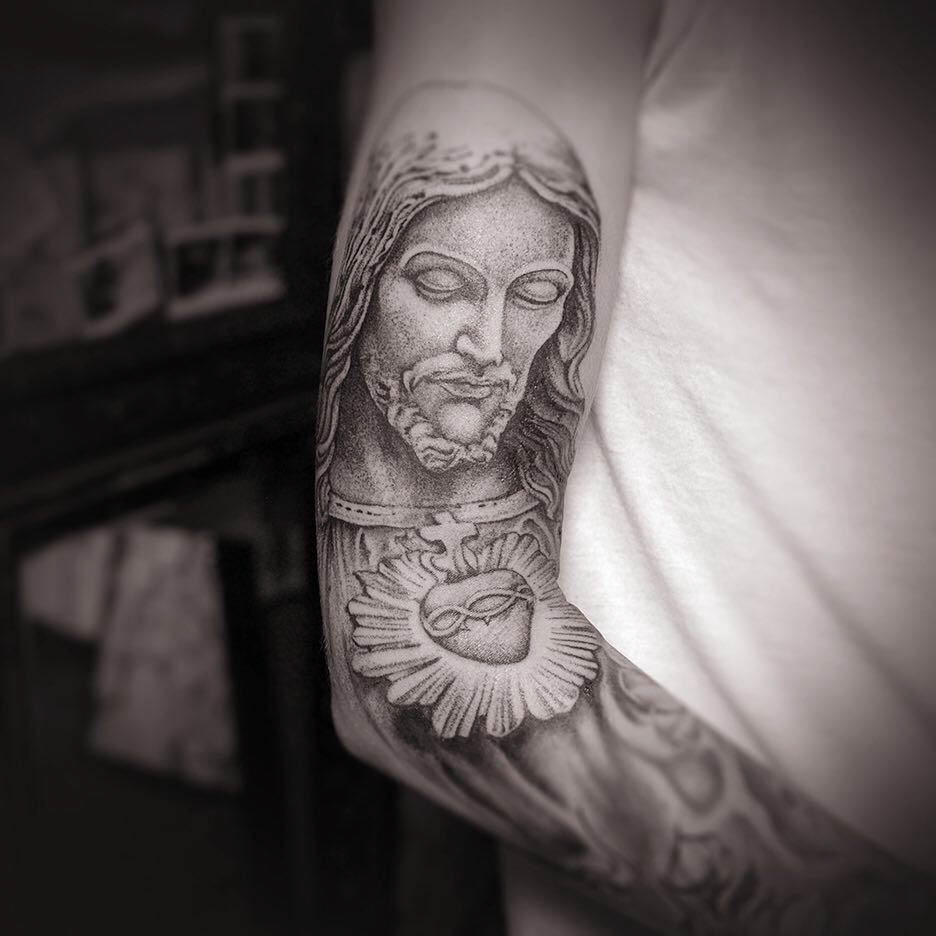 Jesus tattoo on arm