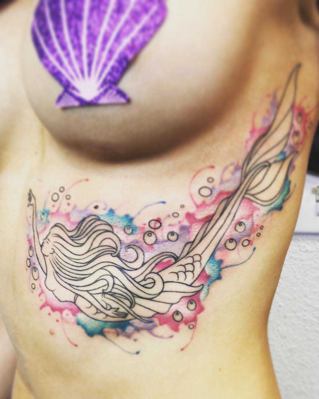 Feminine under breast tattoo
