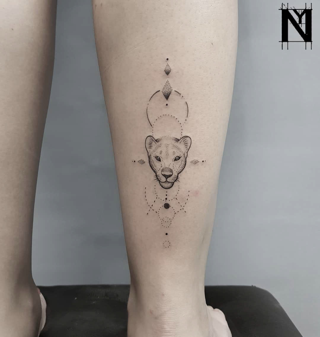 calf tattoo lioness