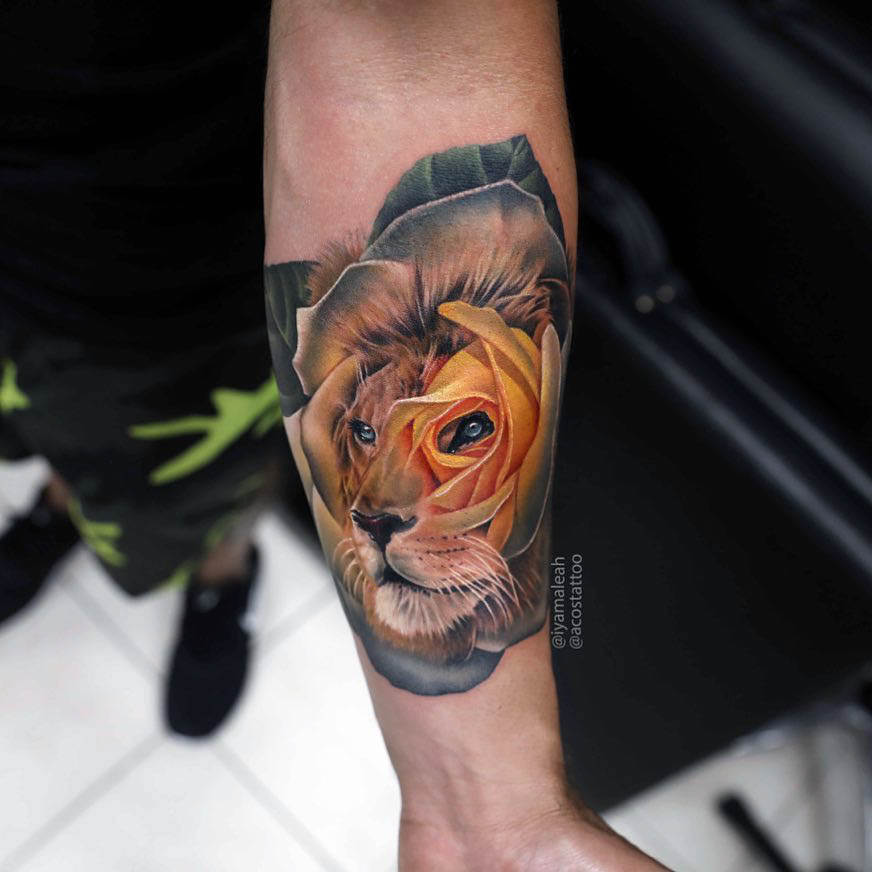 arm tattoo lion rose
