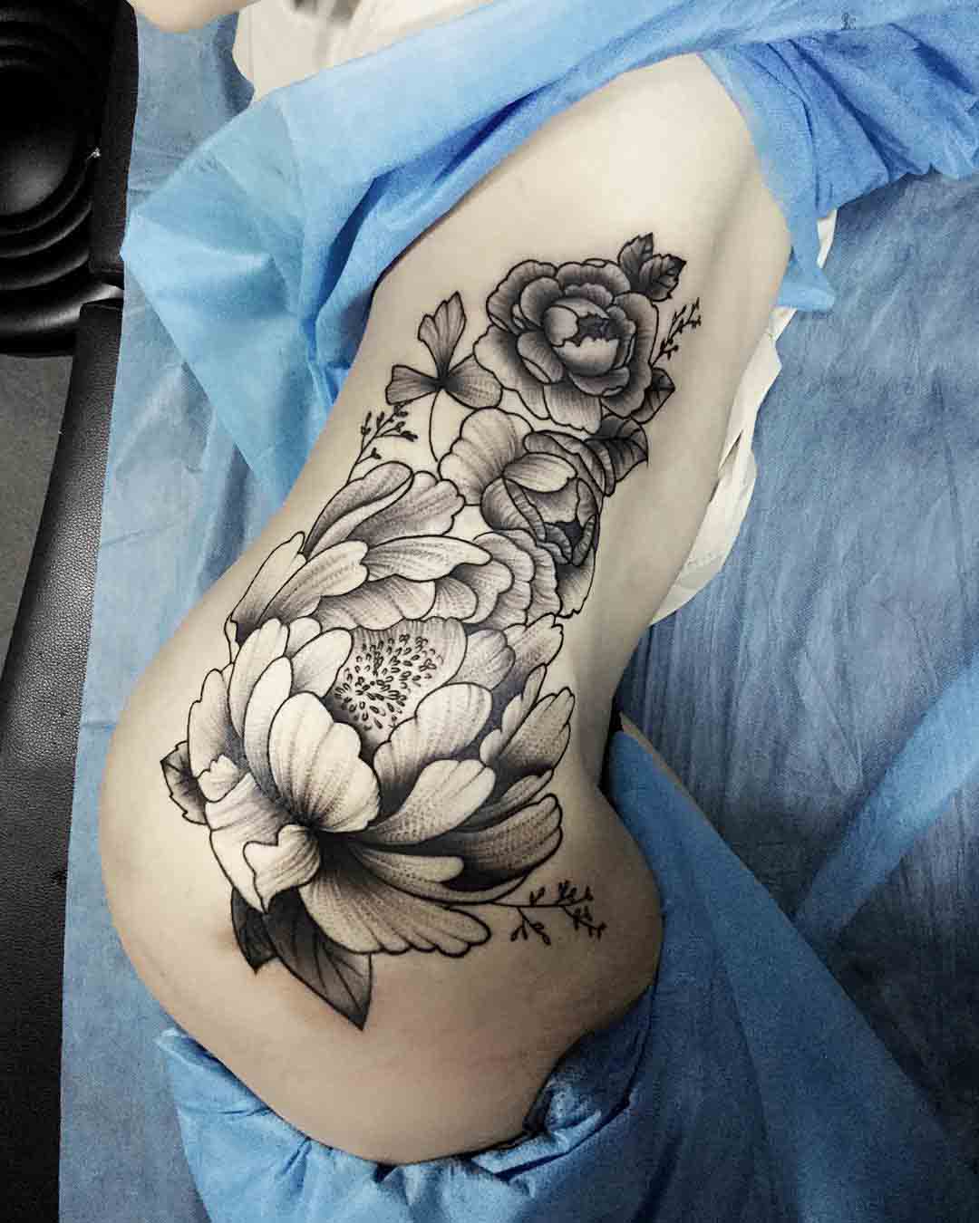 flowers tattoo on hip side