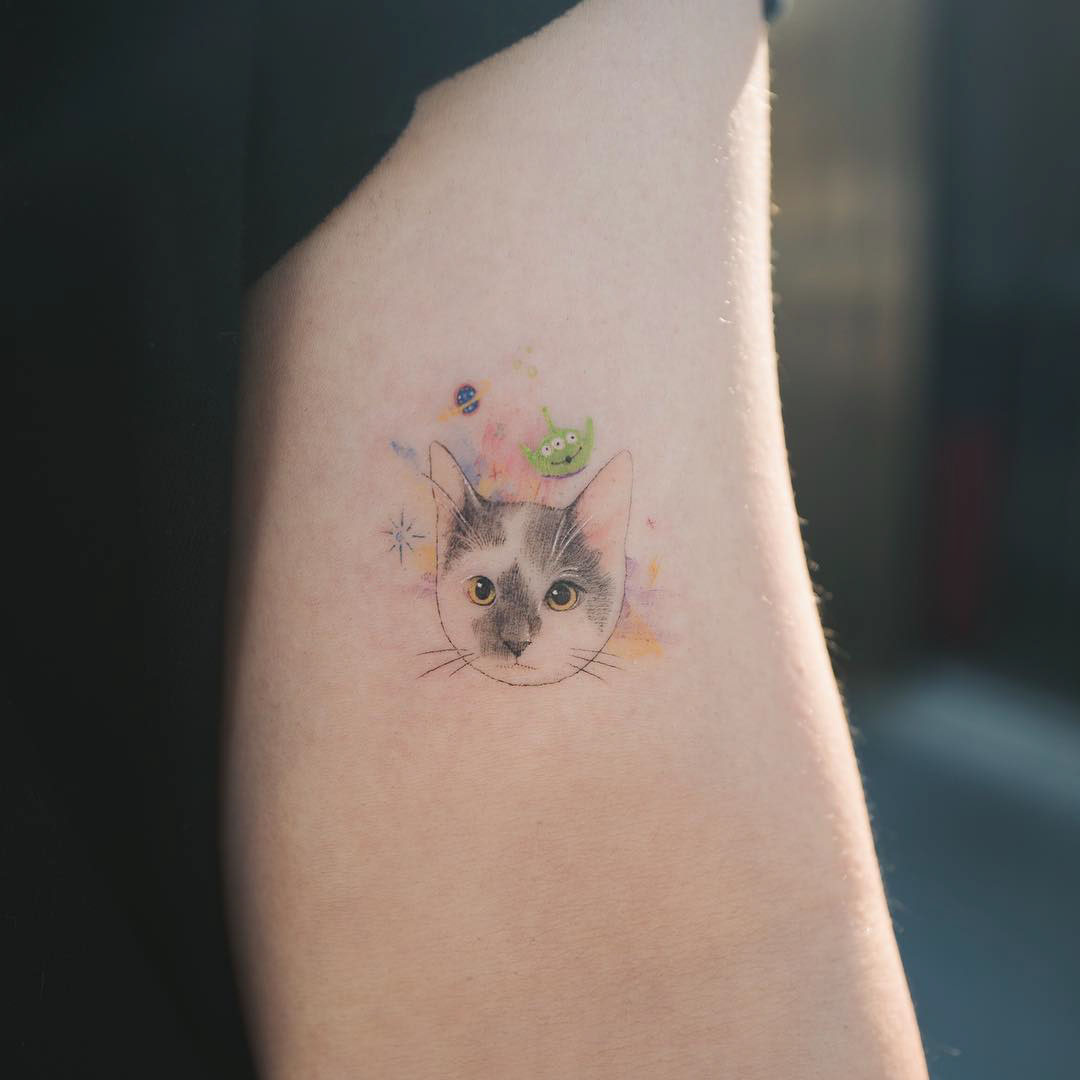 arm small cat tattoo