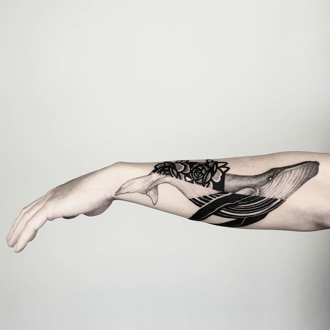 whale tattoo on forearm