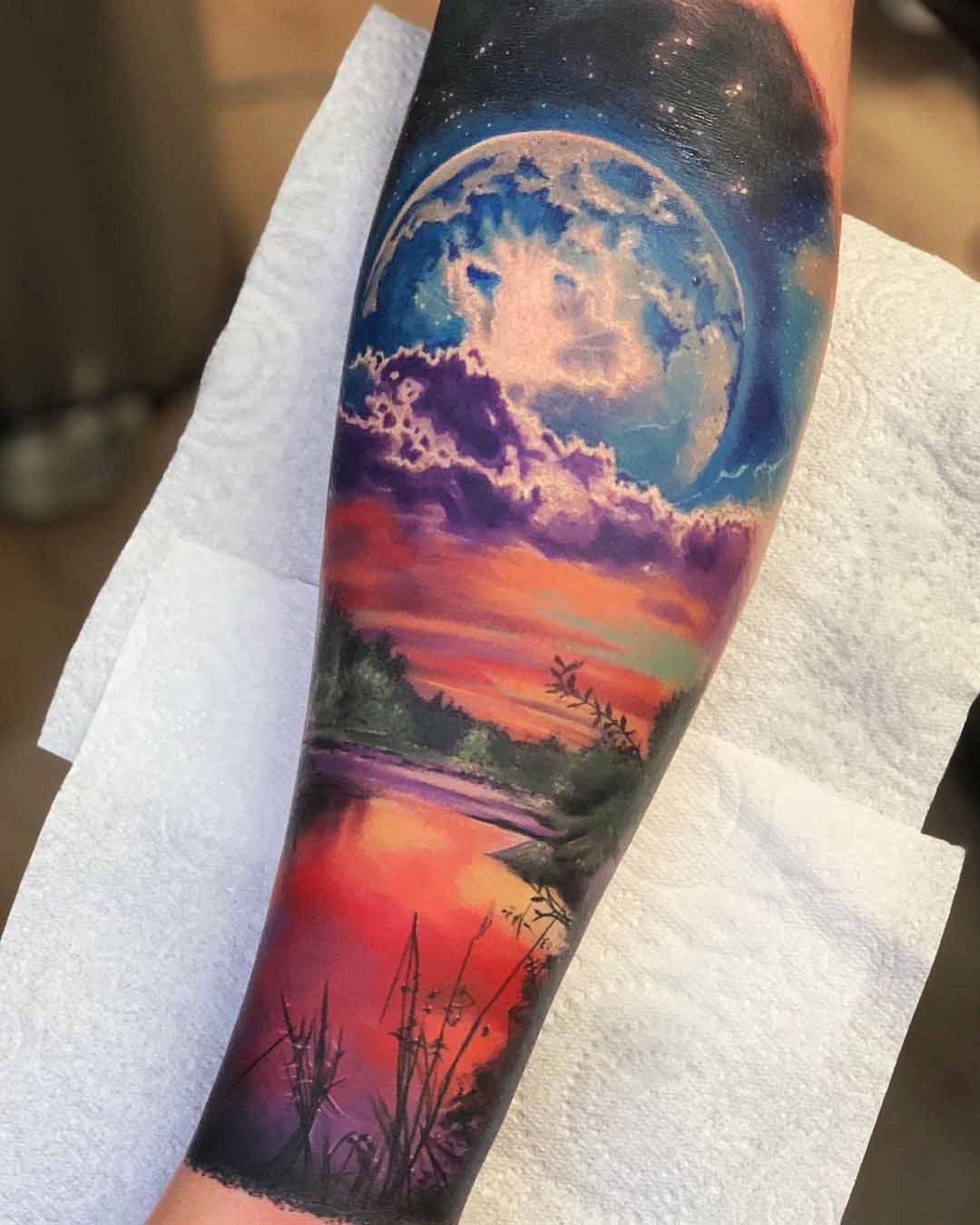 sunset planet landscape tattoo